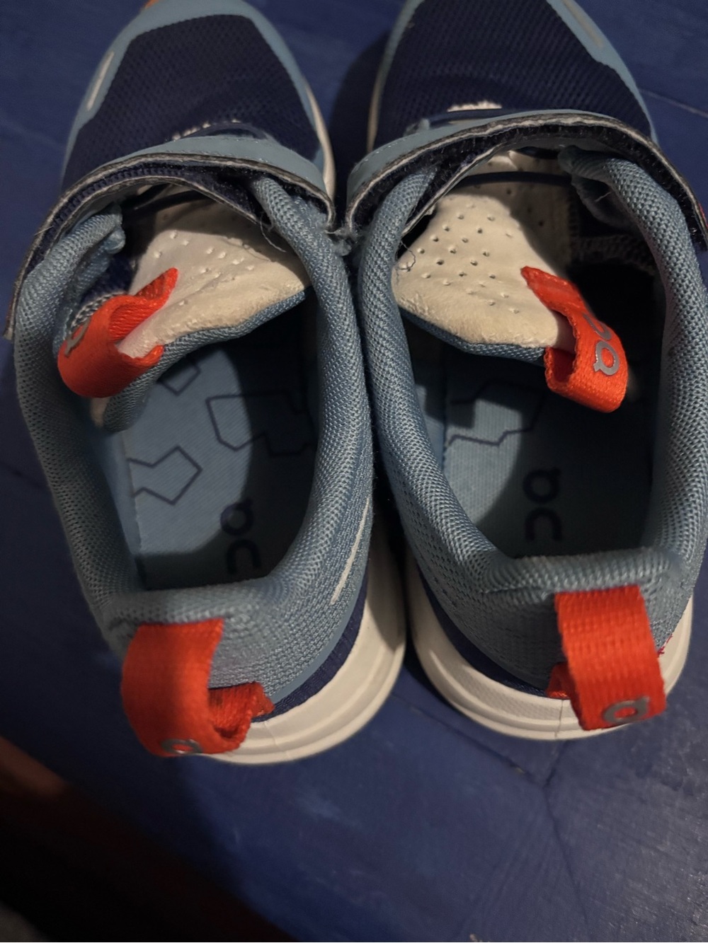 On Clouds Kids Light Blue and Navy Athletic Sneakers with Orange Pull Tabs